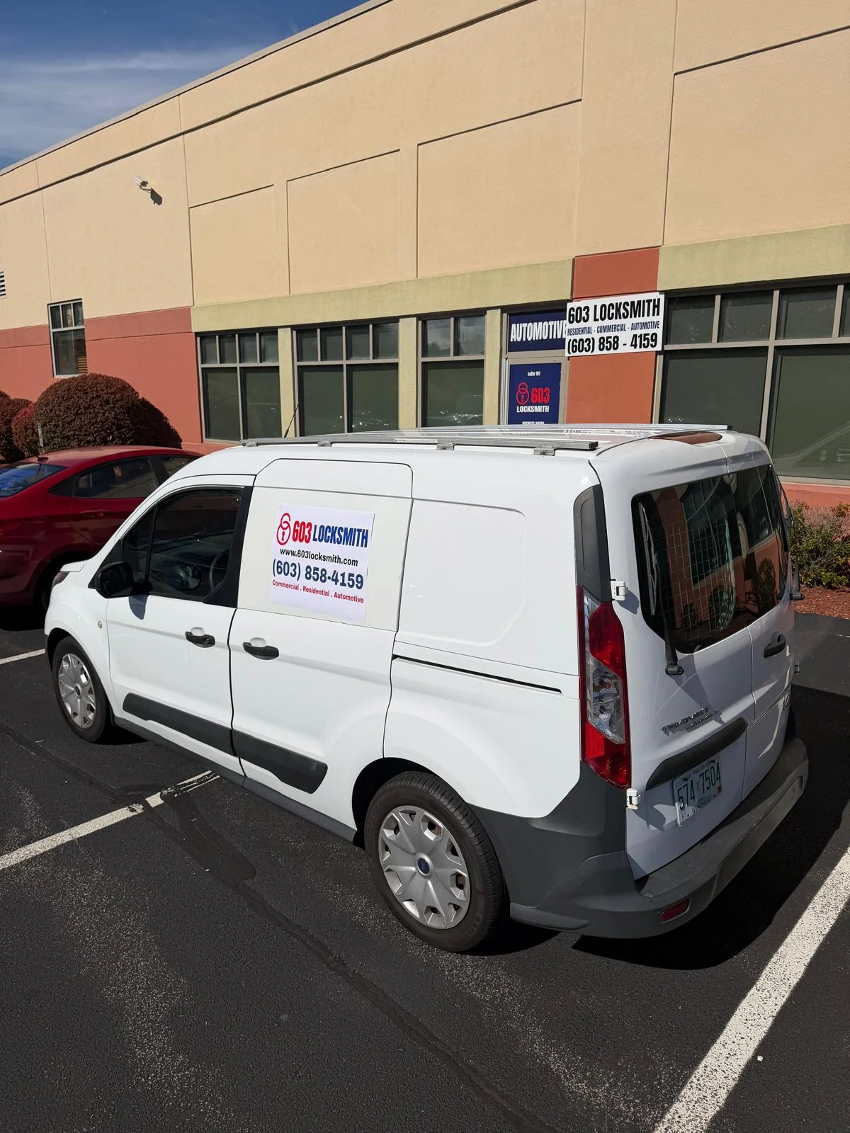 603 Locksmith service van outside the Nashua shop