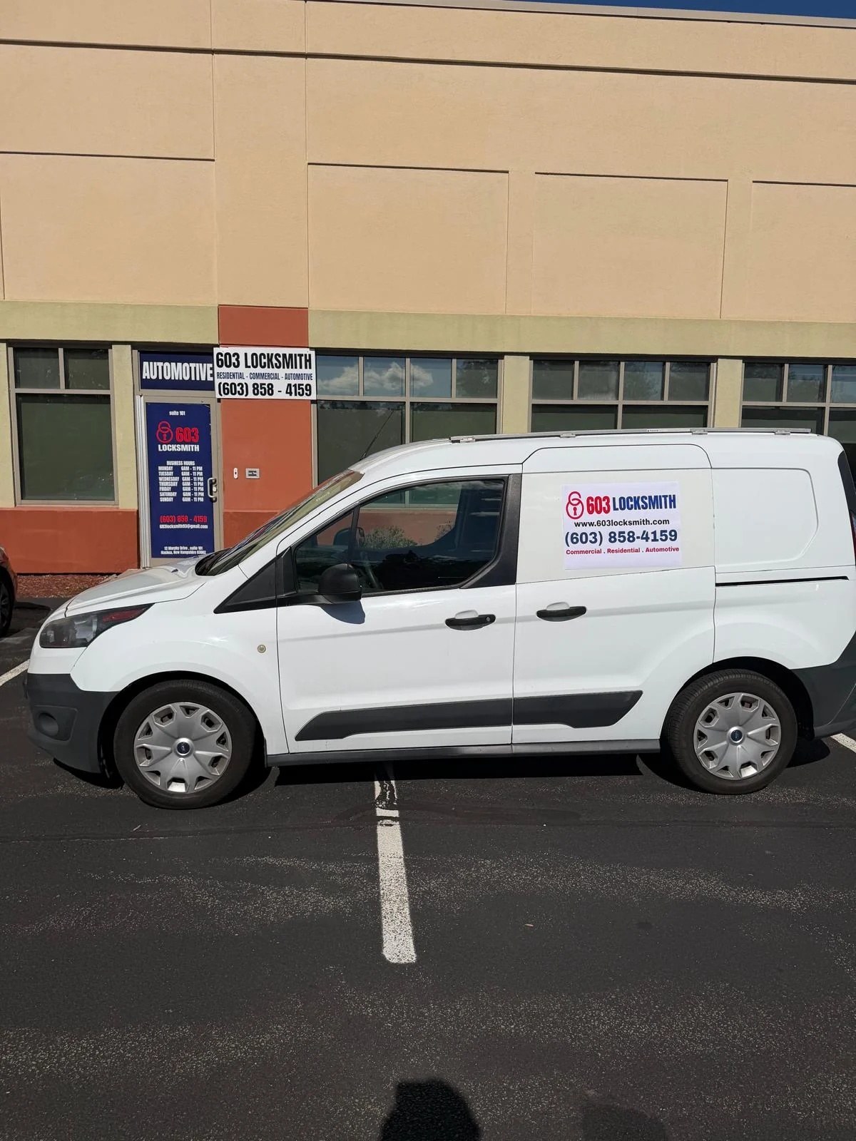 Side view of the branded 603 Locksmith service van